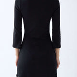 Black dress with 3/4 sleeves on a white background