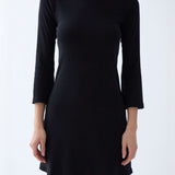 Black dress with long sleeves on a white background