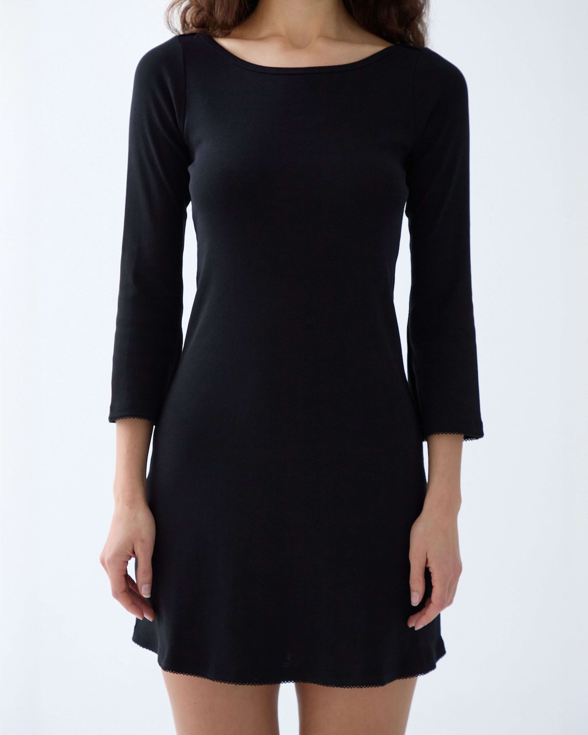 Black dress with long sleeves on a white background