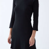 Black dress with long sleeves on a white background