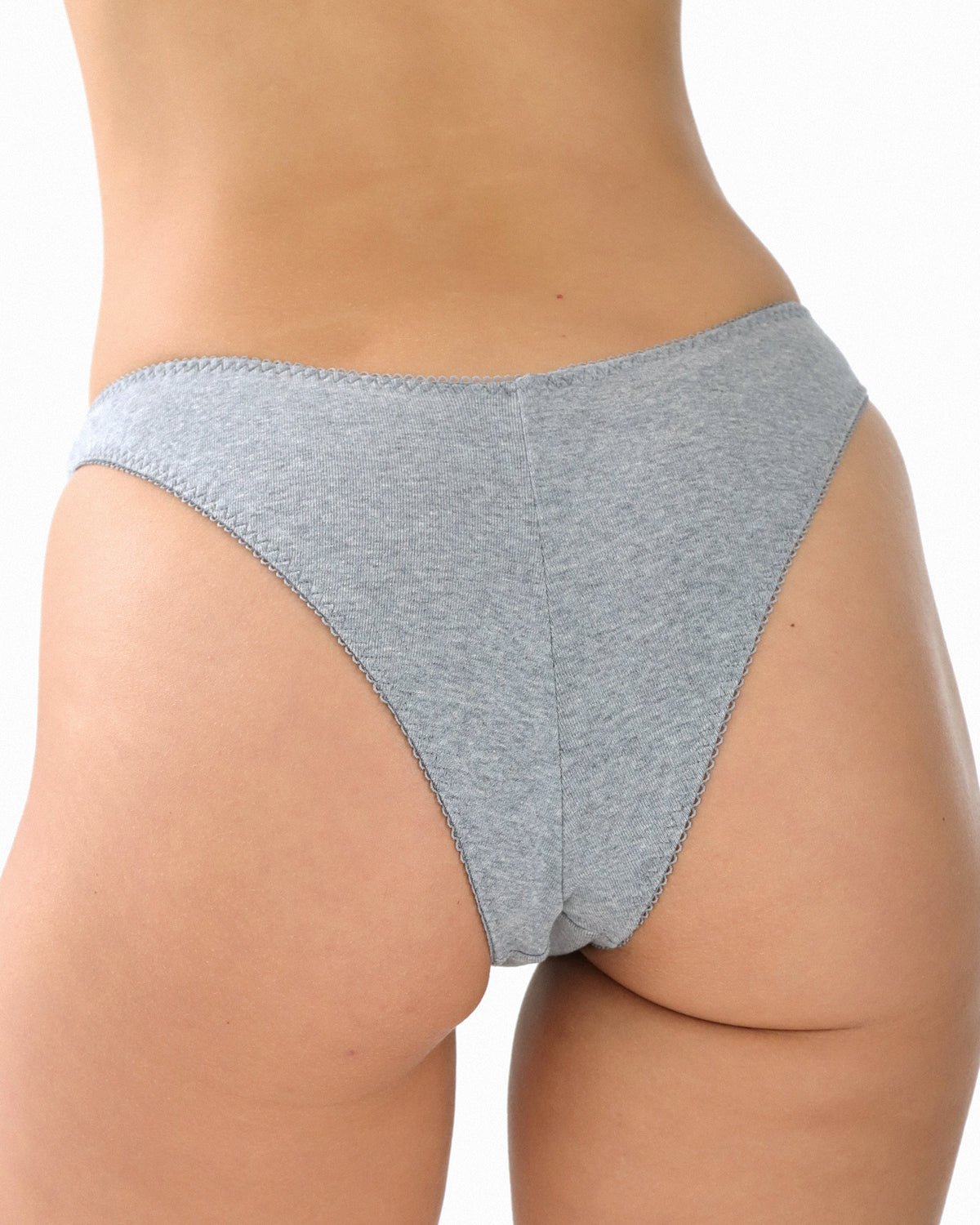 Gray underwear worn by a person on a white background