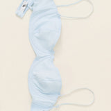 Light blue bra on a beige background