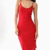 Red dress worn by a model on a white background