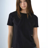 Person wearing a black t-shirt against a plain background