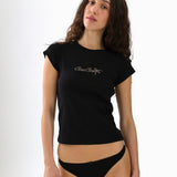 Woman wearing a black t-shirt and underwear set with a visible brand logo on a white background