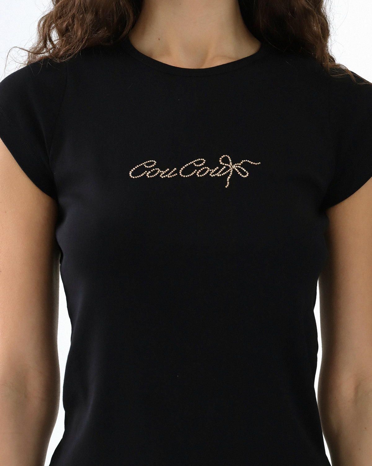 Black t-shirt with Coucou text on a white background