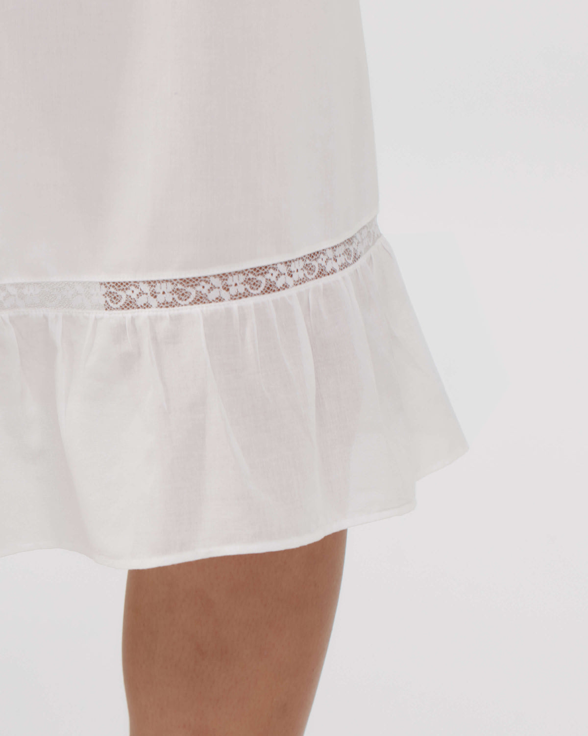 White lace-trimmed nightgown on a white background