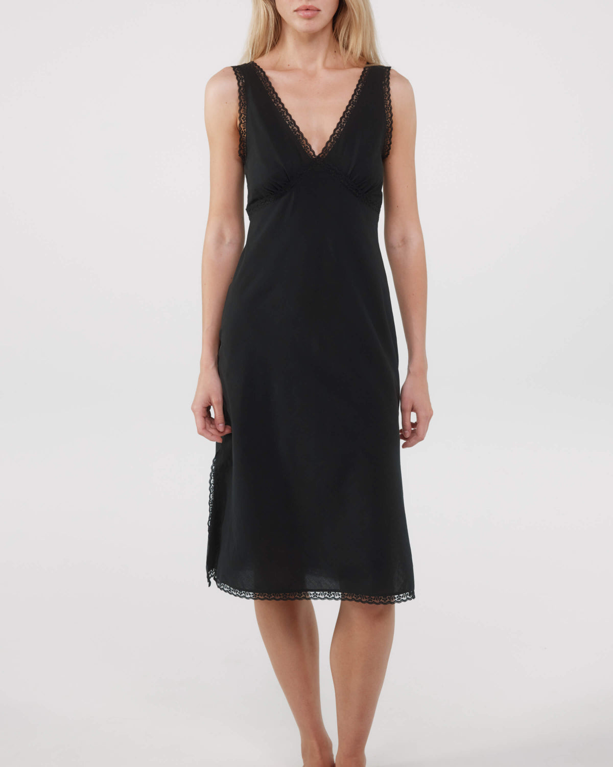 Black dress with lace details on a white background