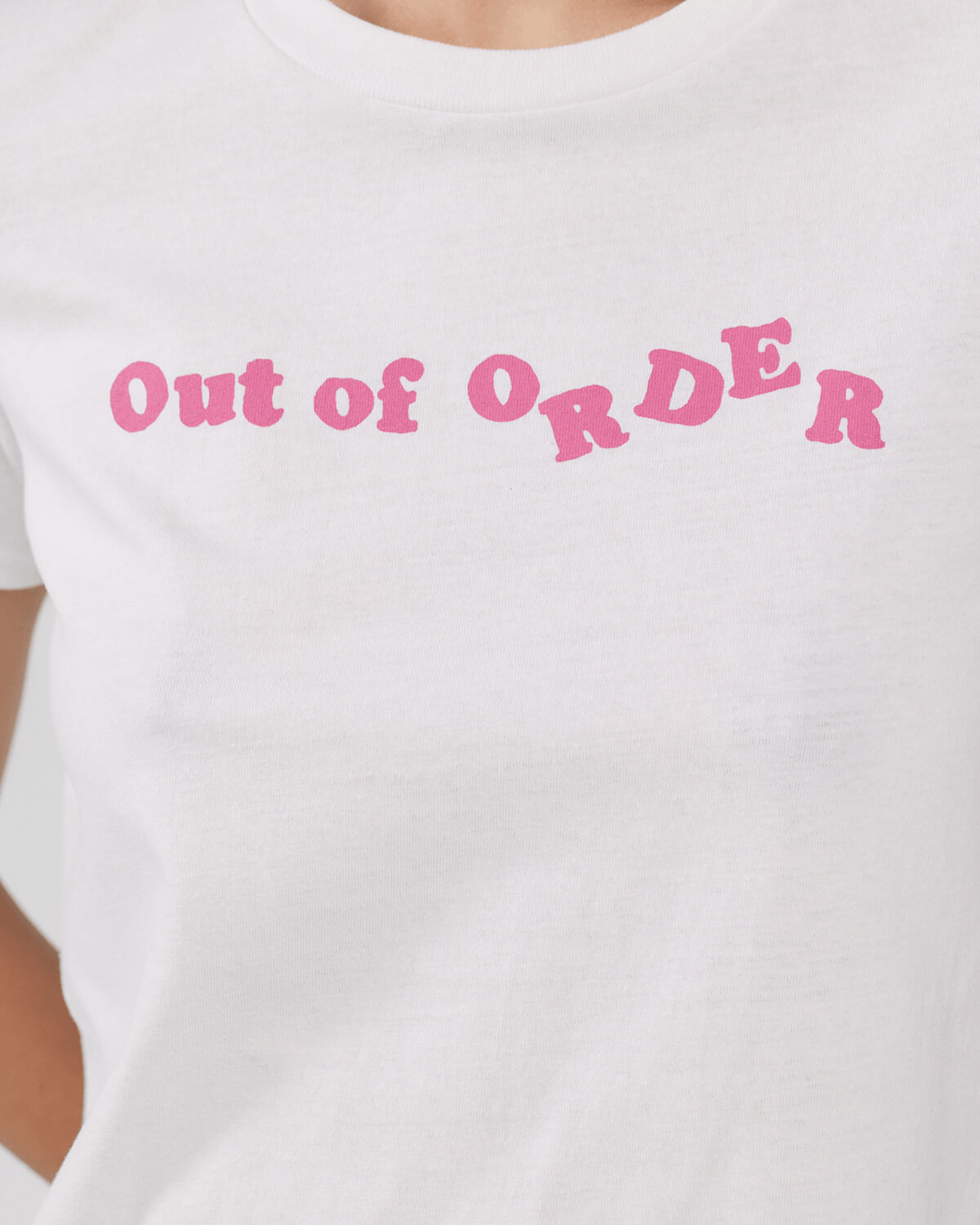 White t-shirt with pink text 'Out of Order' 