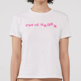 Person wearing a white t-shirt with pink text 'Out of Order' on a plain background