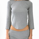 Gray long-sleeve top and shorts set on a white background