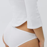 White underwear worn by a person on a plain background