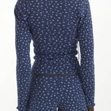 Blue patterned long-sleeve top and shorts set on a white background