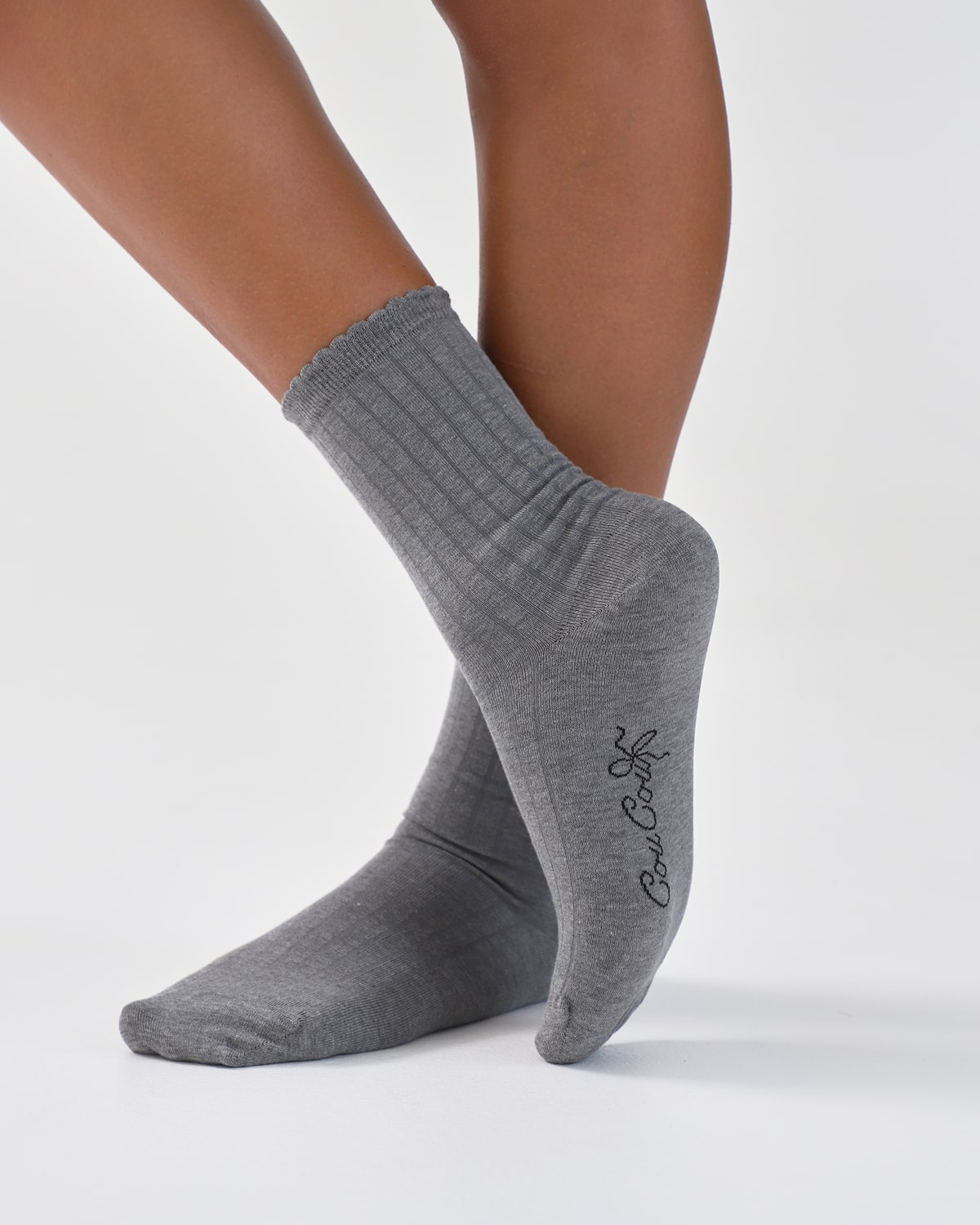 Gray socks with a brand logo on a white background