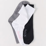 Three pairs of socks in gray, white, and black with text on a light gray background