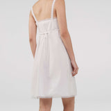 White dress with thin straps on a white background
