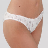 White floral lace underwear on a plain background