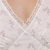 Close-up of a white lace garment with floral patterns